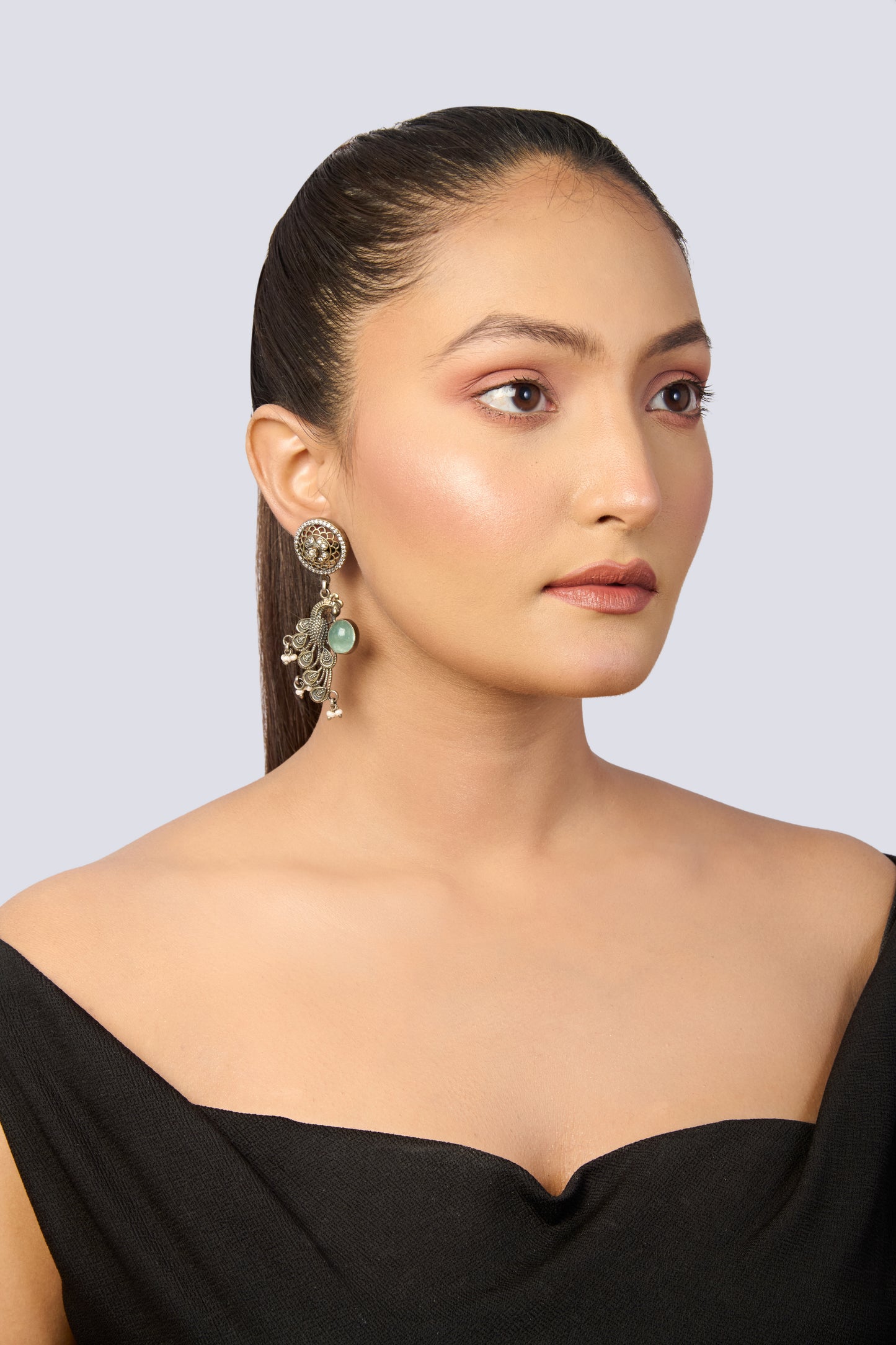 Intricate Oxidized Silver Peacock Earrings with Green Gem and Delicate Accents