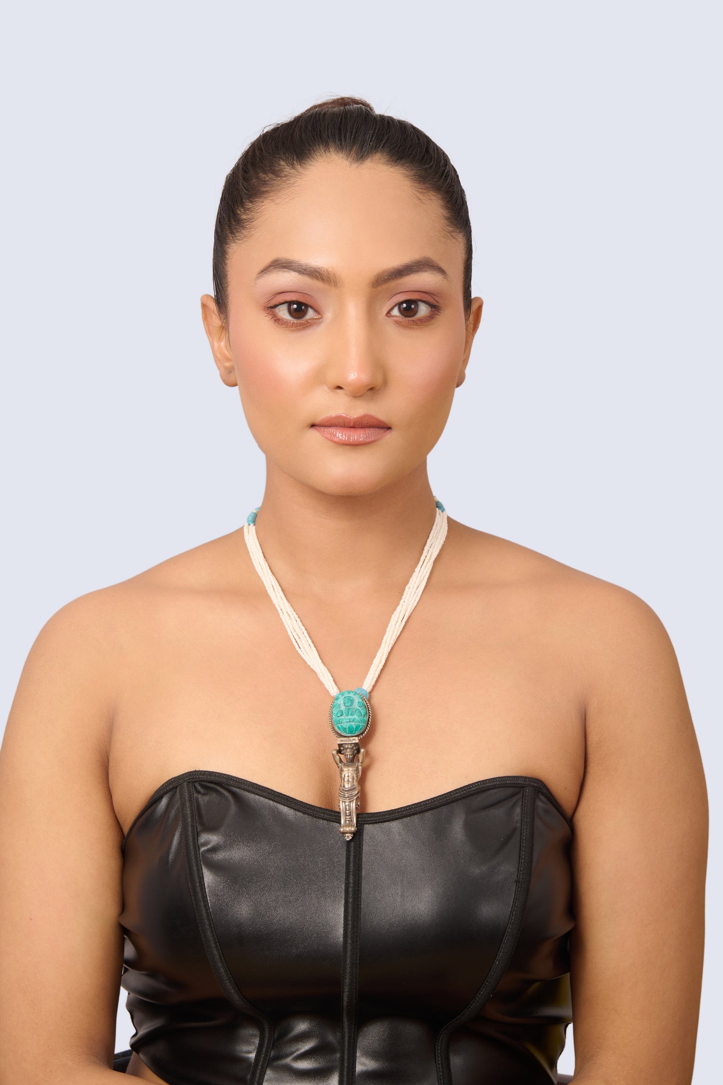 Silver Tone Necklace with Carved Turquoise Pendant, Pearl Strands, and Light Blue Gem Accents