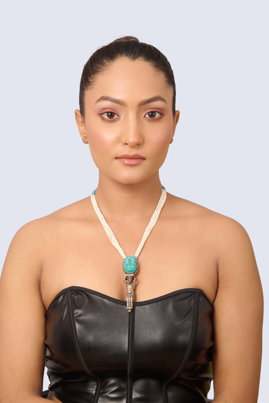 Silver Tone Necklace with Carved Turquoise Pendant, Pearl Strands, and Light Blue Gem Accents