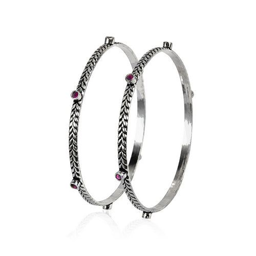 Pair of Oxidized Silver Braided Bangles with Red Gemstone Accents