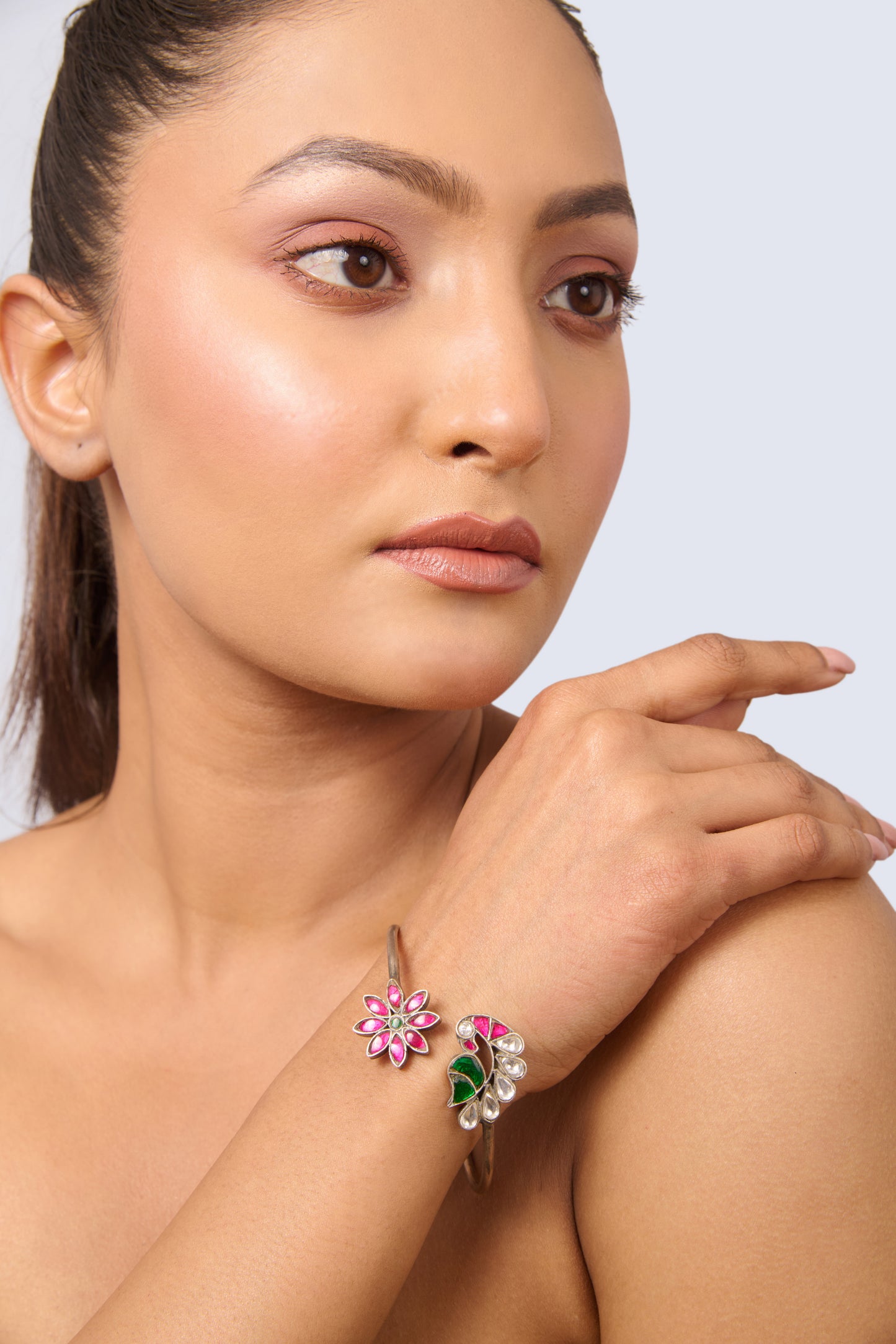 Unique Silver Tone Bangle with Ruby, Emerald, and White Gem Details
