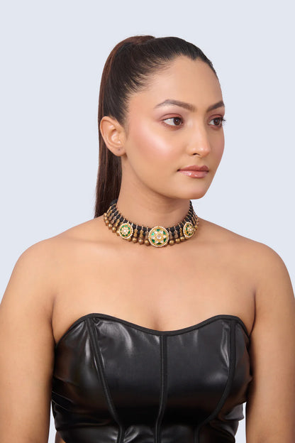 Intricate Necklace with Emerald Center, CZ Details, and Gold Bead Dangles