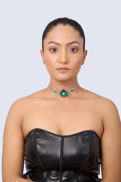Silver Tone Necklace with Heart-Shaped Emerald, Gold Accent, and Floral Gem Details